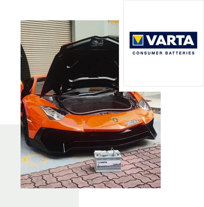 Varta car battery in front of an orange Lamborghini